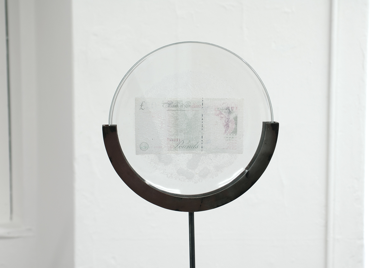David Blackmore: Detail of £105,048.65: £20 Sterling banknote fused by bleach on to an IKEA plate on mild steel armature
